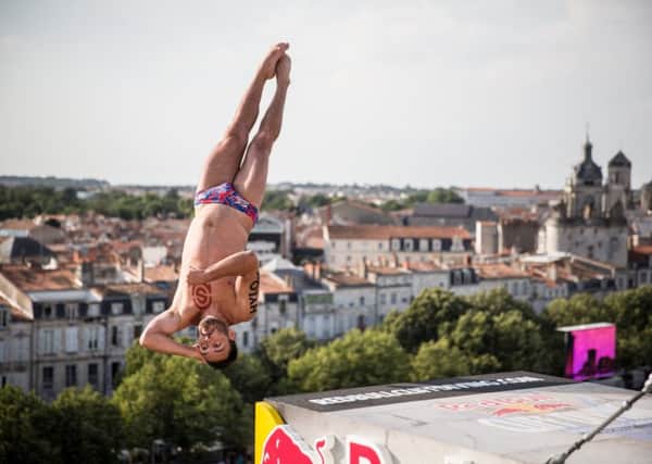 Blake Aldridge of the UK dives from the 27 metre platform on the Saint Nicolas Tower during the first competition day of the fourth stop of the Red Bull Cliff Diving World Series in La Rochelle, France on July 22, 2016. // Romina Amato/Red Bull Content Pool // P-20160722-04979 // Usage for editorial use only // Please go to www.redbullcontentpool.com for further information. //