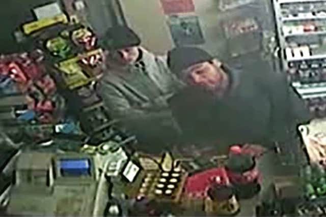 Police hunt two men in connection with '˜frightening' robbery