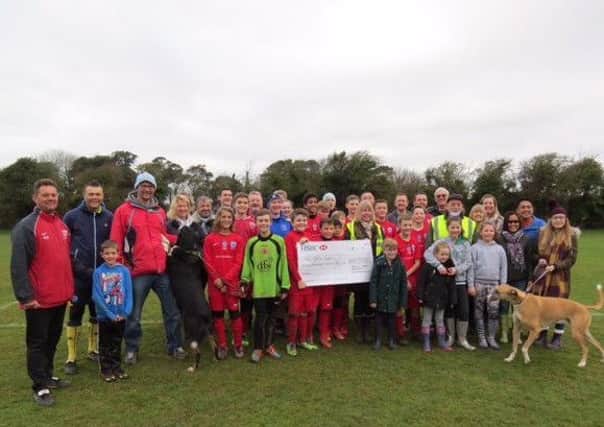 The cheque was presented by the lions to the under 13s on Sunday (January 8)