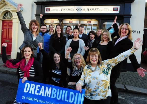 Parsons Son & Basley staff with St Wilfrids staff celebrating their support. To become a Dreambuilder call Chloe Neilson-Hopkins on 01243 755186. ks170012-2 SUS-170117-184614008
