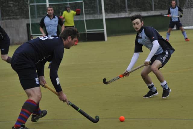 Alex Coombs closes down a Kings & Alleyns opponent during Saxons' 4-3 victory on December 10. Picture by Simon Newstead