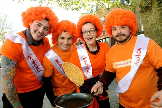Rotary Club of Horsham's annual community pancake race hosted by Dave Benson Phillips. Sainsbury team. Pic Steve Robards   SR1604880 SUS-160216-150539001