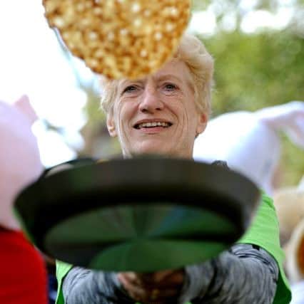 Rotary Club of Horsham's annual community pancake race hosted by Dave Benson Phillips. Samaritan Caroline Thomas. Pic Steve Robards   SR1604935 SUS-160216-152641001