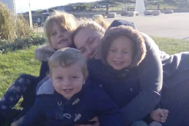 Daniella Gray, 23, with her children Jessie, five, Jake, three and Alfie, one