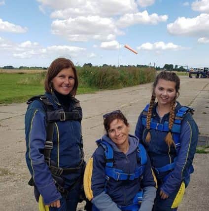 Amanda with eldest daughter Meg and a friend who all did a tandem skydive on the anniversary of her accident on Bury Hill