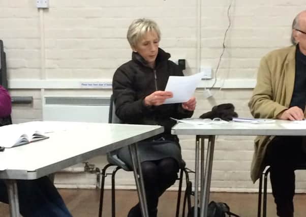 Louise Goldsmith being handed the notice from Chichester Deserves Better at last Thursday's Funtington Parish Council meeting