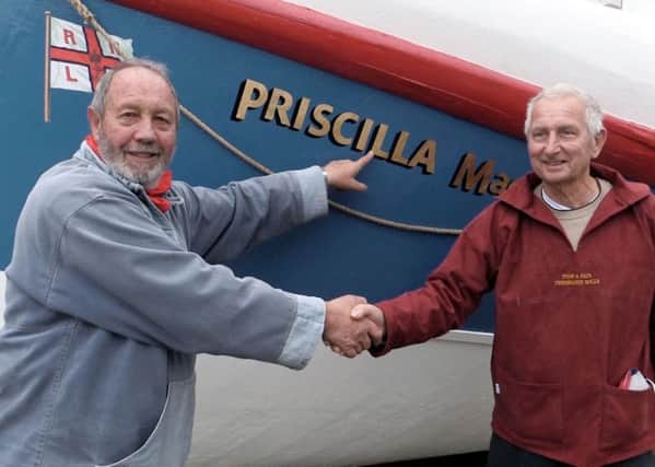 Dee Day White (left) and Tush Hamilton, by the Priscilla MacBean, another lifeboat recently renovated by the pair and volunteers. SUS-141116-120358001