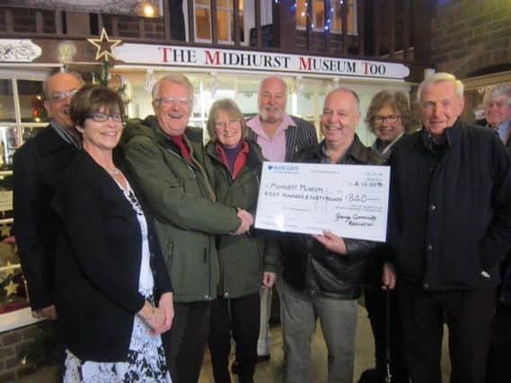Chairman of Midhurst Museum Peter Nightingale receives a grant