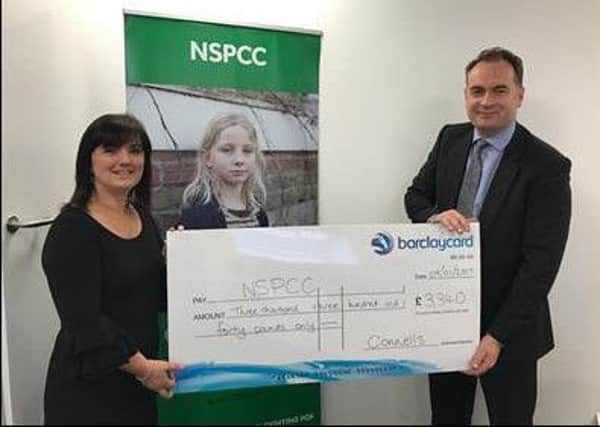 David Plumtree, Connells Group Estate Agency chief executive, presenting the cheque to Jacqui Venters, NSPCC community fundraising manager