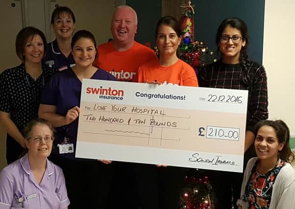 Staff from Swinton Insurance's branch in South Street, Tarring, presenting a cheque for Â£210 to Love Your Hospital