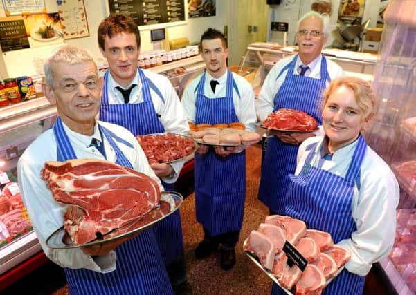 Owner Chris White with staff in Knight Butchers as it is today, celebrating the 60th anniversary. Picture: Steve Robards SR1700349