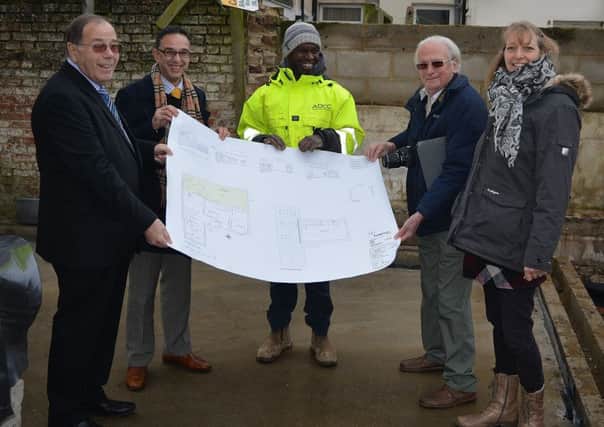Stuart Earl, Dan Redsull, Nick Alleyne, Chris Ashford and Claire Lands examine plans for the project on-site. SUS-170117-114726001