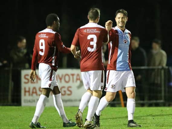 Frannie Collin (right) is congratulated by Adam Green and Kiernan Hughes-Mason after scoring against Three Bridges last Tuesday night. Picture courtesy Scott White