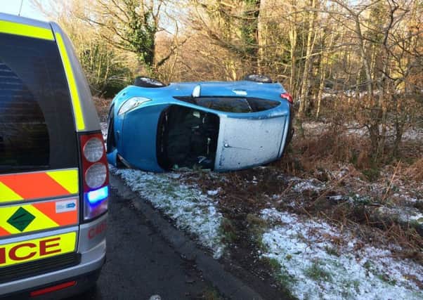 A Ford Fiesta was left on its side on the A271 near Battle after crashing this morning (Friday, January 13). Photo courtesy of Battle Fire Station SUS-170113-110850001