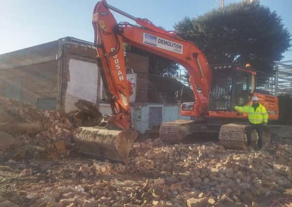 Work has begun on demolishing buildings within Devonshire Park to make way for a new players' village