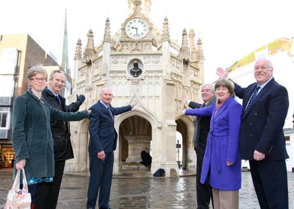 Chichester city councillors in front of the newly refurbished and cleaned Market Cross