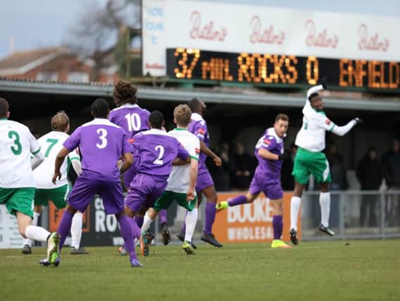 Scorer Elijah Adebayo wins a header as the Rocks attack Enfield / Picture by Tim Hale