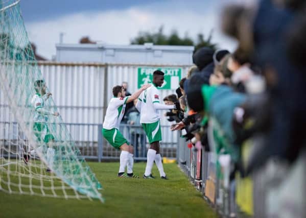 Elijah Adebayo celebrats his first Rocks goal - versus Enfield - with the fans / Picture by Tim Hale