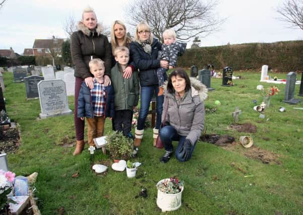 Glenis Miller and family at Andrew Miller's grave