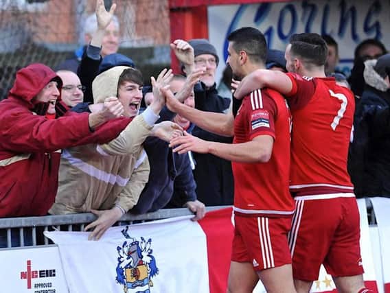 Worthing's players and fans celebrate the opening goal against Sutton on Saturday. Picture by Stephen Goodger