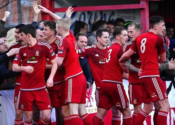Worthing players celebrate their opening goal against Sutton United on Saturday. Picture: Stephen Goodger