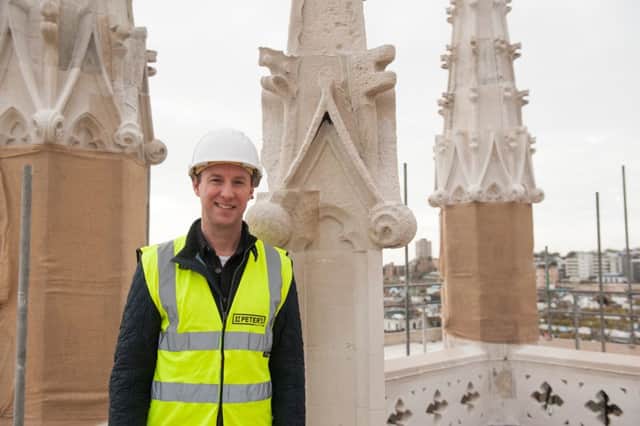 Vicar Archie Coates at the top of St Peter's tower last week (Photograph: Elle-Anna Smith/St Peter's Brighton) SUS-170116-131805001