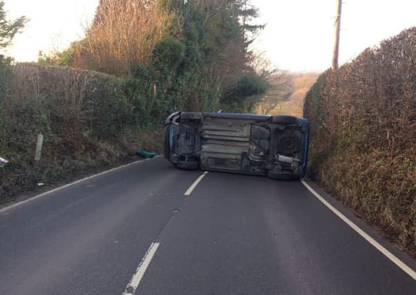 The blue Citroen car ended up on its side after crashing on Carricks Hill, Dallington. Photo courtesy of Battle Fire Station