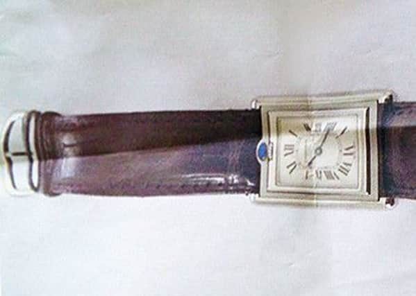 Sussex Police have released an image of a cartier watch stolen during a burglary in Littlehampton