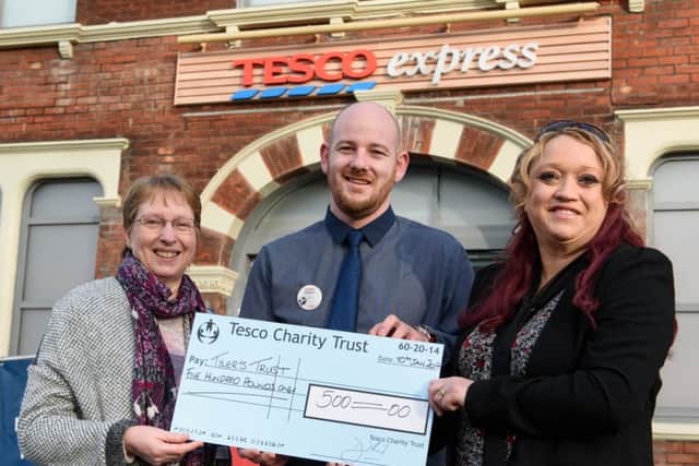 Barnham Tesco Express manager Nathan Branston presents Janice Ellis and Sue Hollingdale from Tylers Trust with the cheque for Â£500. Picture: Richard Eaton