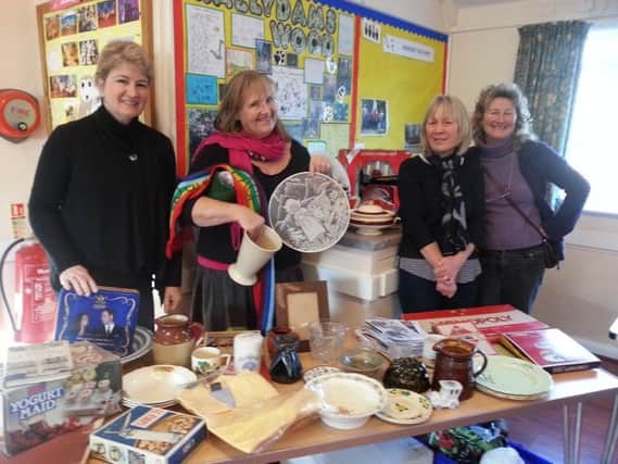 Crowhurst and District Horticultural Society members and Chairman Mary Boorman (second from left) with some of the donated items at the Jumble Sale SUS-170124-094951001
