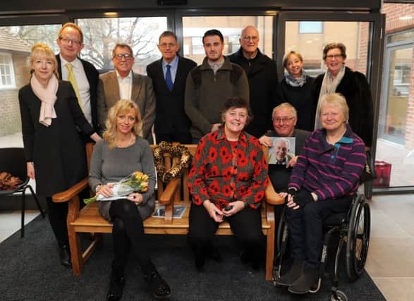 Nigel Calder's children and Crawley councillors with the new bench. Picture: Jon Rigby