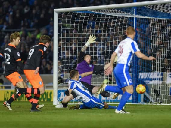Anthony Knockaert slides home Albion's winner. Picture by Phil Westlake (PW Sporting Photography)