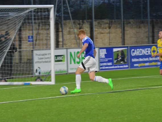 Trevor McCreadie scores the second goal. Lancing v Haywards Heath Town. Picture by Grahame Lehkyj