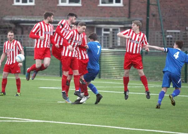 Steyning players challenge for the ball during Saturday's SCFL Division 1 Challenge Cup quarter-final with East Preston. Picture: Derek Martin DM1712656