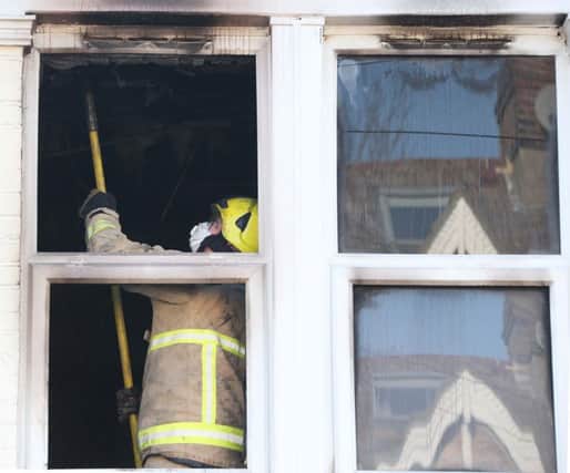 Firefighters at the scene of a fire in Loder Road (Photograph: Eddie Mitchell) SUS-170123-104712001