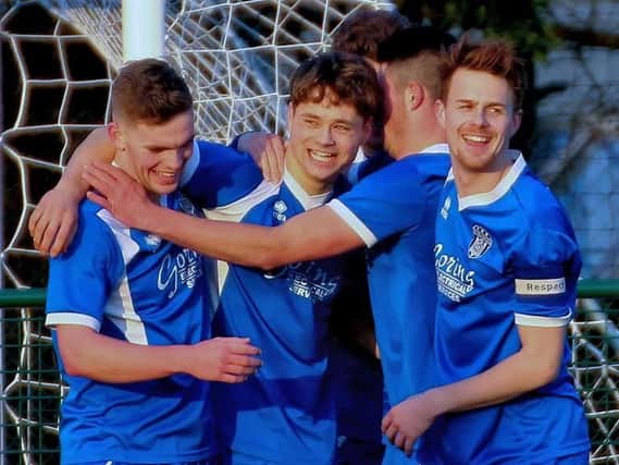 Jared Rance celebrates with his team-mates after netting on Saturday. Picture by Terry Buckman