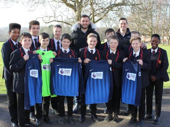 Steve Cook with the Ark William Parker Academy year eight football team and Jimmy Elford.