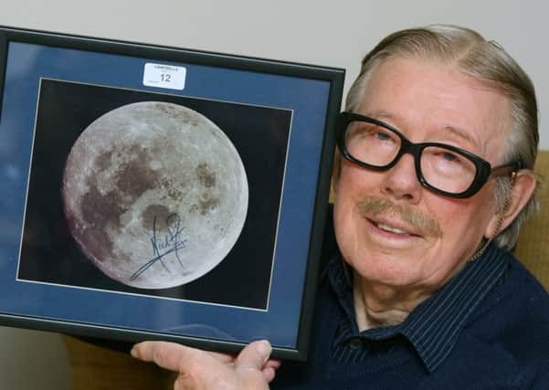 Peter Algar buys Neil Armstrong's signature. Picture: Derek Martin