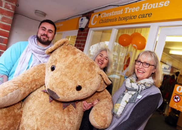 Arundel's Chestnut Tree House charity shop is celebrating its 15th anniversary, from left, Stuart Farndell, Janet Parsons and Boodie Ellison. Photo by Derek Martin DM1714014a