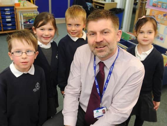 Richard Roberts, head of Arunside School, with some of his pupils