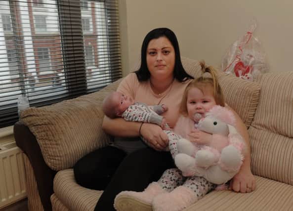 Simone Muzzall, four-week-old Freddie and Lacey, two, who suffers from asthma, were left in the cold for days