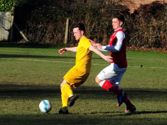 Action from Upper Beeding's clash at league leaders Bosham on Saturday. Picture: Kate Shemilt