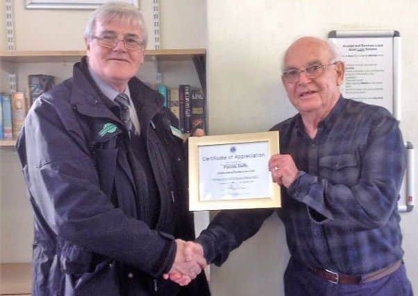 John Taylor from Littlehampton District Lions presents Patrick Duffy with a Certificate of Appreciation