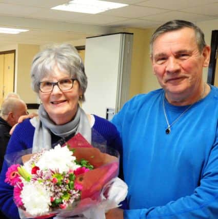 John Wood presenting organiser Kathy Whitby with a bouquet of flowers from the group to thank her for her work with the club ks170047-6