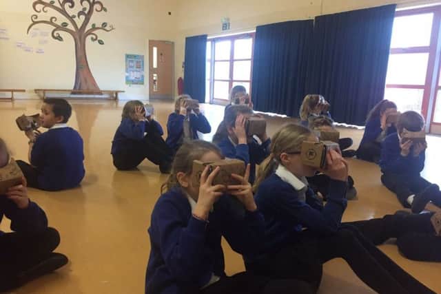 Year five pupils wearing Google Cardboards in the virtual reality lesson earlier today (February 2)