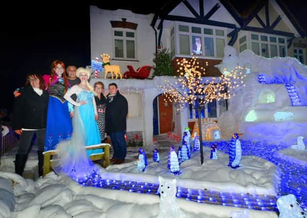 Switch-on of Blacklands' WInter Wonderland 2016.

Paul and Rosina Brockington pictured with Anna and Elsa from the film Frozen. Also pictured are Paul Wilson from Hastings Round Table and Jodie Cornford from St Michael's Hospice. SUS-161126-153226001