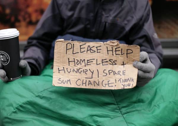 File photo dated 18/03/16 of Lucas, a homeless man, holding a sign reading 'Please help, homeless and hungry' in Victoria, London, as ministers were accused of ignoring the plight of the homeless as new figures showed a sharp rise in the number of people sleeping rough on the streets of England. PRESS ASSOCIATION Photo. Issue date: Wednesday January 25, 2017. Local authorities estimated on a single night in autumn 2016 there were 4,134 rough sleepers compared to 3,569 the previous year - an increase of 16% - according to figures compiled by the Department for Communities and Local Government (DCLG). See PA story POLITICS Homeless. Photo credit should read: Yui Mok/PA Wire PPP-170126-115119001