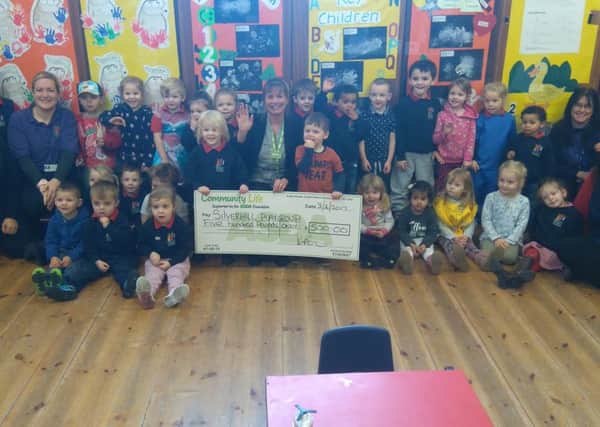 Asda, St Leonards on Sea donated ?500 from the stores green token scheme to Silverhill Nursery. SUS-170702-121100001