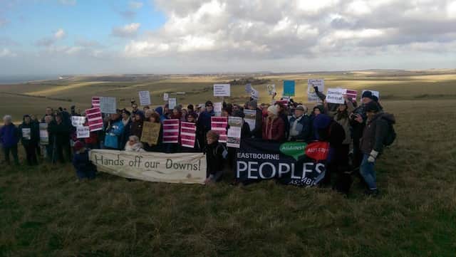 Campaigners protesting the council sale of the downland farms SUS-170302-141059001