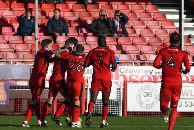 Crawley Town players celebrate James Collins' opening goal. Picture by PWW Sporting Photography